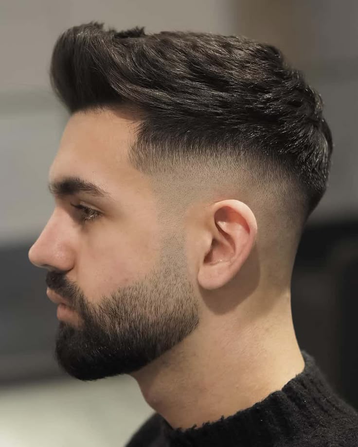 7. Faux Hawk with Mid Skin Fade